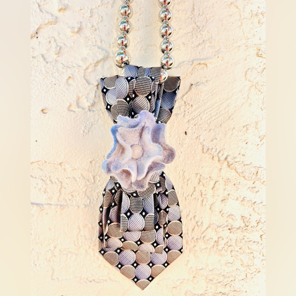 Silk tie necklace with wool brooch